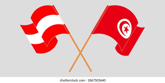 Banderas cruzadas y ondeando banderas de Austria y Túnez