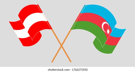 Crossed and waving flags of Azerbaijan and Austria