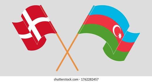 Crossed and waving flags of Azerbaijan and Denmark
