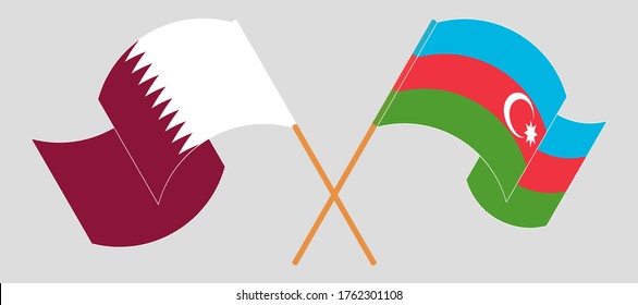 Crossed and waving flags of Azerbaijan and Qatar