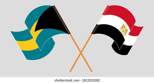 Crossed and waving flags of Bahamas and Egypt