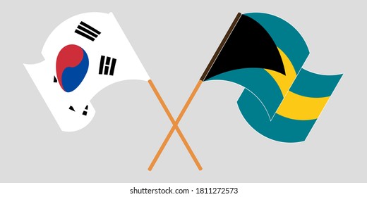 Crossed and waving flags of Bahamas and South Korea