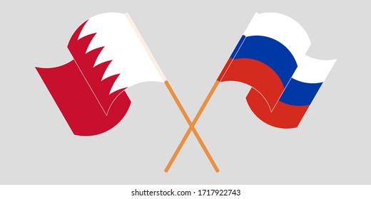 Crossed and waving flags of Bahrain and Russia