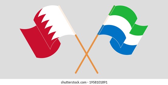 Crossed and waving flags of Bahrain and Sierra Leone
