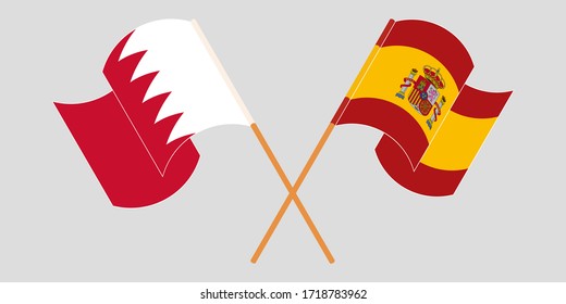 Crossed and waving flags of Bahrain and Spain