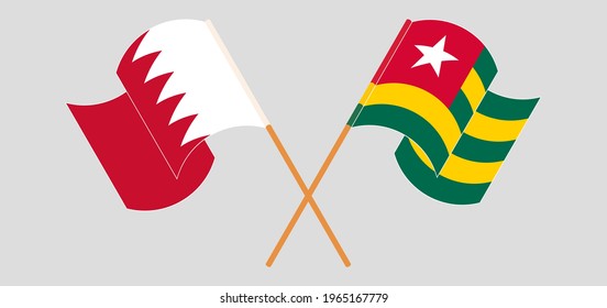 Crossed and waving flags of Bahrain and Togo. Vector illustration