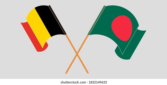Crossed and waving flags of Bangladesh and Belgium