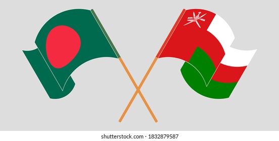 Crossed and waving flags of Bangladesh and Oman