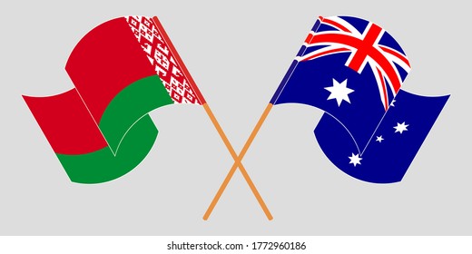 Crossed and waving flags of Belarus and Australia