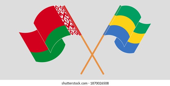 Crossed and waving flags of Belarus and Gabon