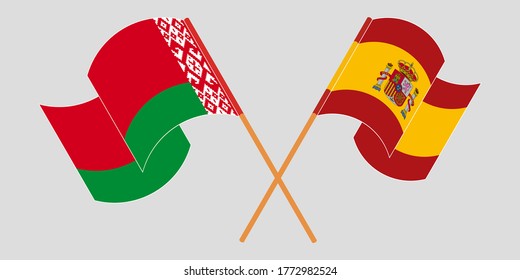 Crossed and waving flags of Belarus and Spain