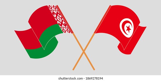 Crossed and waving flags of Belarus and Tunisia