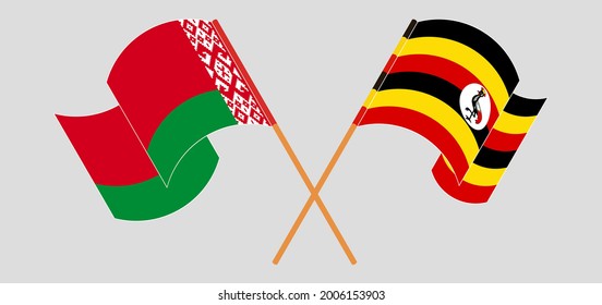 Crossed and waving flags of Belarus and Uganda