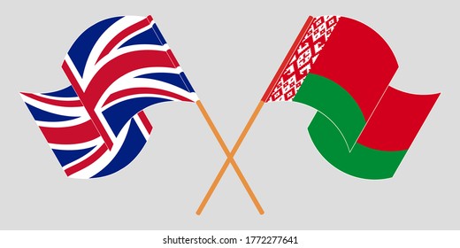 Crossed and waving flags of Belarus and the UK