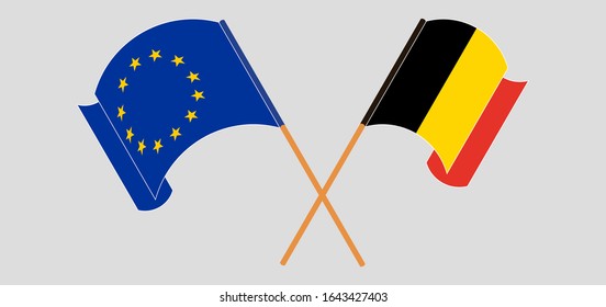 Crossed and waving flags of Belgium and the EU