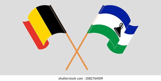 Crossed and waving flags of Belgium and Kingdom of Lesotho. Vector illustration
