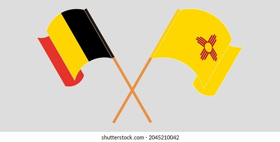 Crossed and waving flags of Belgium and the State of New Mexico