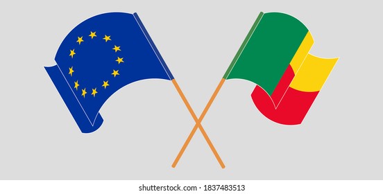 Crossed and waving flags of Benin and the EU