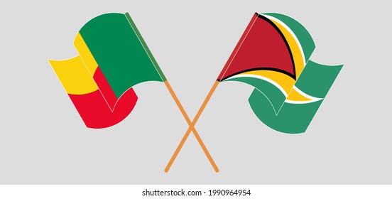 Gekreuzte und wehende Flaggen von Benin und Guyana