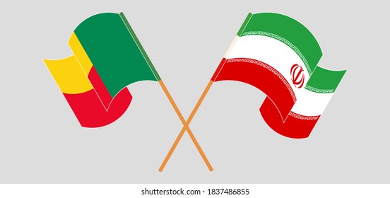 Crossed and waving flags of Benin and Iran