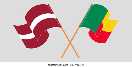 Crossed and waving flags of Benin and Latvia
