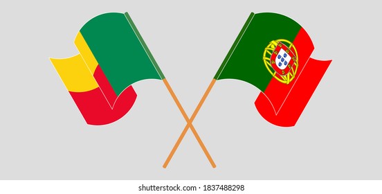 Crossed and waving flags of Benin and Portugal