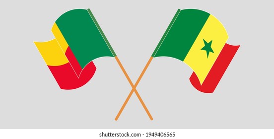 Crossed and waving flags of Benin and Senegal