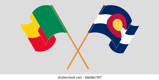 Crossed and waving flags of Benin and The State of Colorado