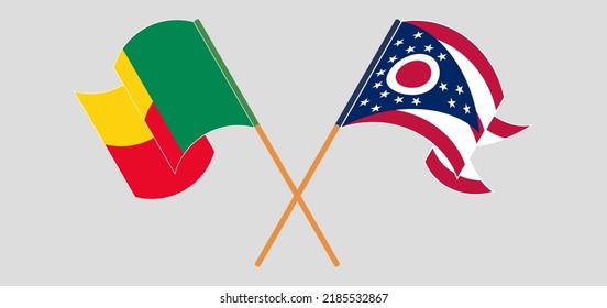 Crossed and waving flags of Benin and the State of Ohio. Vector illustration
