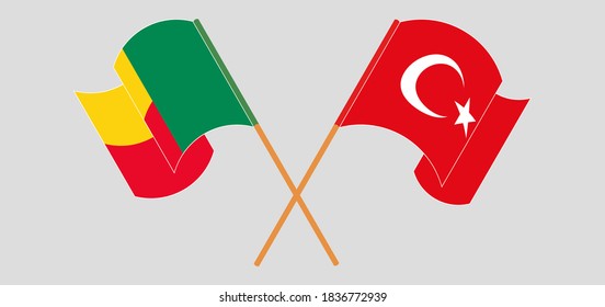 Crossed and waving flags of Benin and Turkey