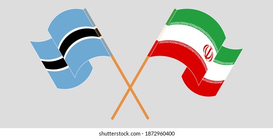 Crossed and waving flags of Botswana and Iran