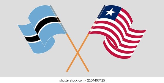 Crossed and waving flags of Botswana and Liberia. Vector illustration
