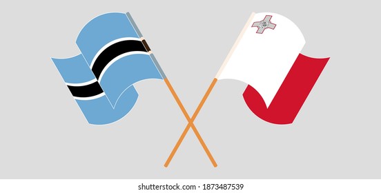 Crossed and waving flags of Botswana and Malta