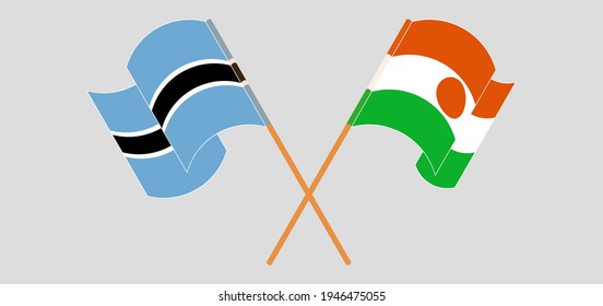 Crossed and waving flags of Botswana and Niger