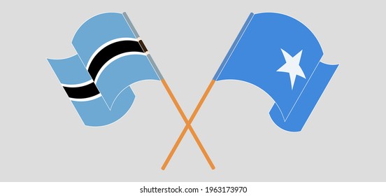 Crossed and waving flags of Botswana and Somalia