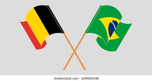 Crossed and waving flags of Brazil and Belgium