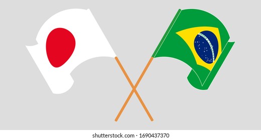 Crossed and waving flags of Brazil and Japan