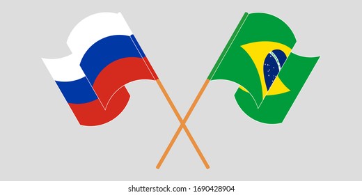 Crossed and waving flags of Brazil and Russia
