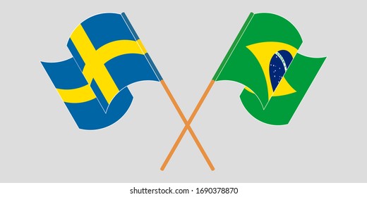 Crossed and waving flags of Brazil and Sweden