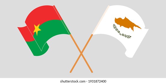 Crossed and waving flags of Burkina Faso and Cyprus