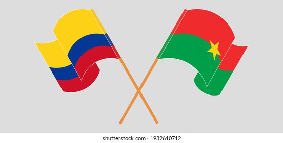 Crossed and waving flags of Burkina Faso and Colombia