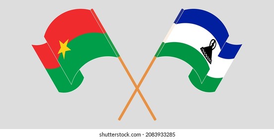 Überquerte und schwellende Flaggen von Burkina Faso und Königreich Lesotho. Vektorgrafik
