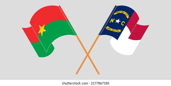 Überquerte und wehende Flaggen von Burkina Faso und dem Staat North Carolina. Vektorgrafik
