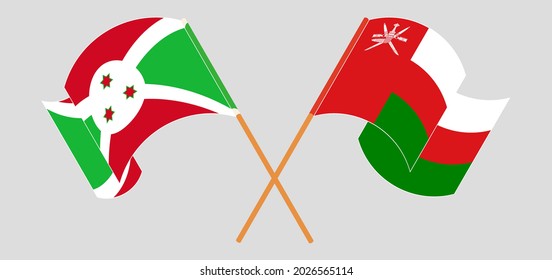 Crossed and waving flags of Burundi and Oman