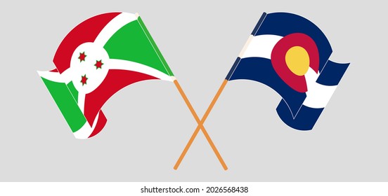 Crossed and waving flags of Burundi and The State of Colorado