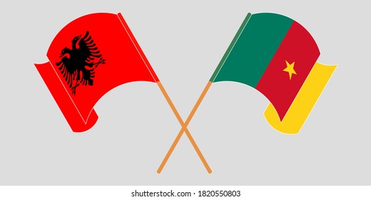 Crossed and waving flags of Cameroon and Albania
