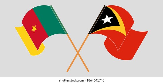 Banderas cruzadas y ondeando banderas de Camerún y Timor Oriental