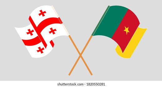Cruzando y ondeando banderas de Camerún y Georgia