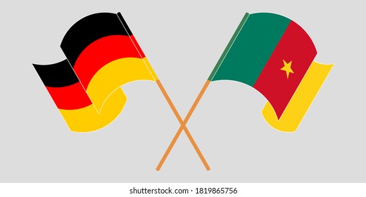 Banderas cruzadas y ondeando banderas de Camerún y Alemania