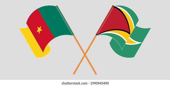 Banderas cruzadas y ondeando banderas de Camerún y Guyana
